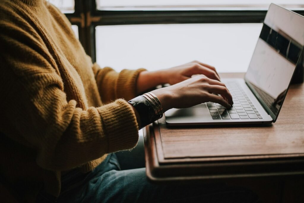 Person working on a laptop for digital learning, illustrative stock photography
